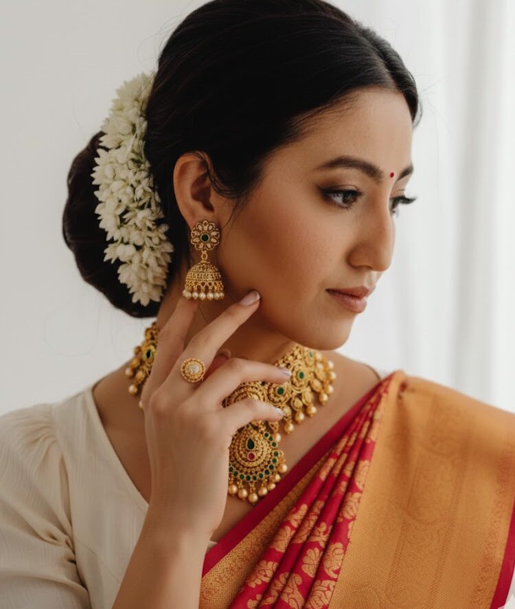 a girl wearing ornaments of murli gold